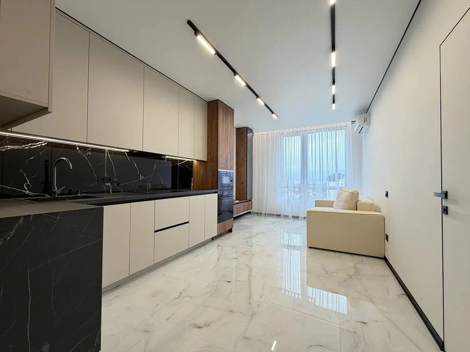 One-room apartment with furniture and appliances near the lake