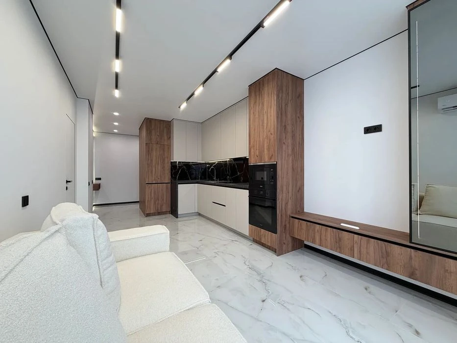 One-room apartment with furniture and appliances near the lake