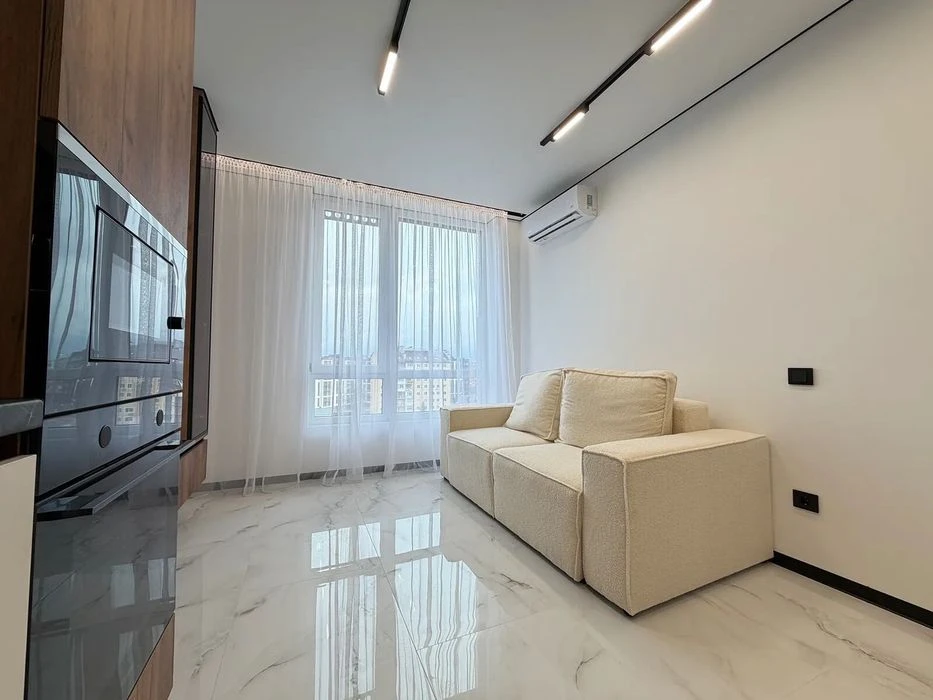 One-room apartment with furniture and appliances near the lake