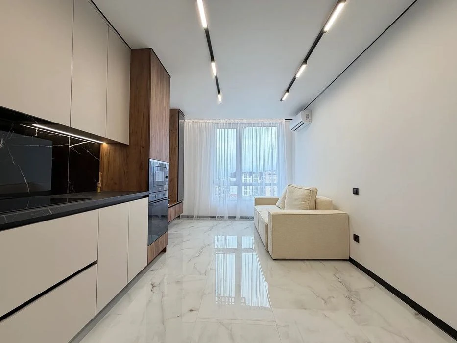 One-room apartment with furniture and appliances near the lake