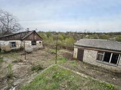 House with a plot of 10 acres + garage, possible exchange for a car.