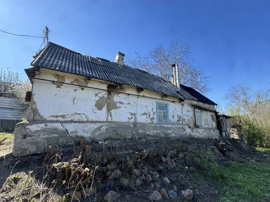 House with a plot of 10 acres + garage, possible exchange for a car.