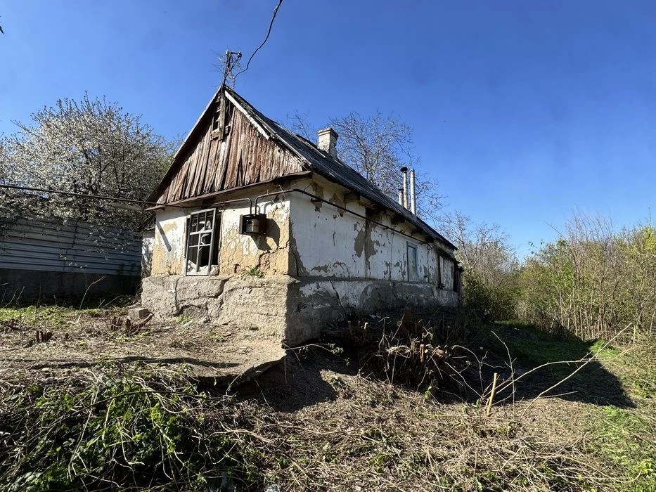 House with a plot of 10 acres + garage, possible exchange for a car.