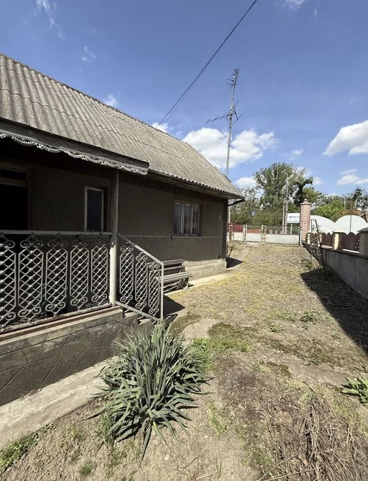 Продаж будинку з земельною ділянкою по вул. М. Олімпіади, 34