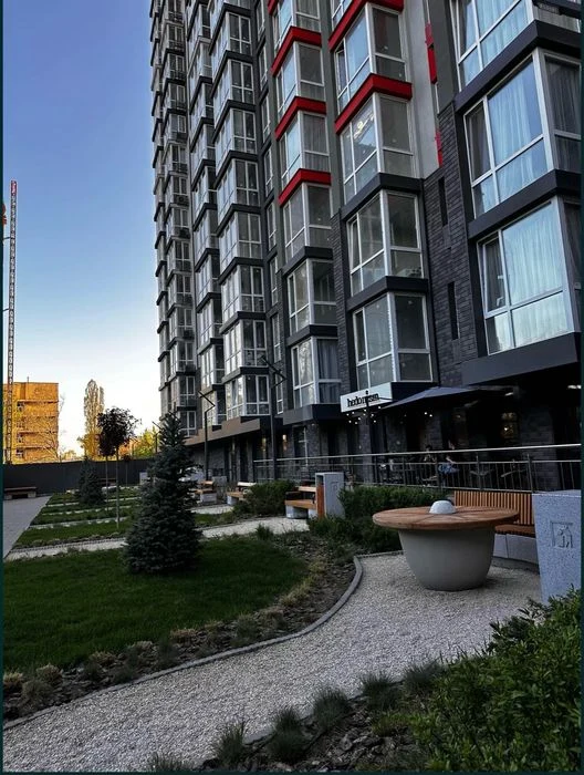 An apartment with an area of 25.40 m² is offered for sale in the residential complex 4U.