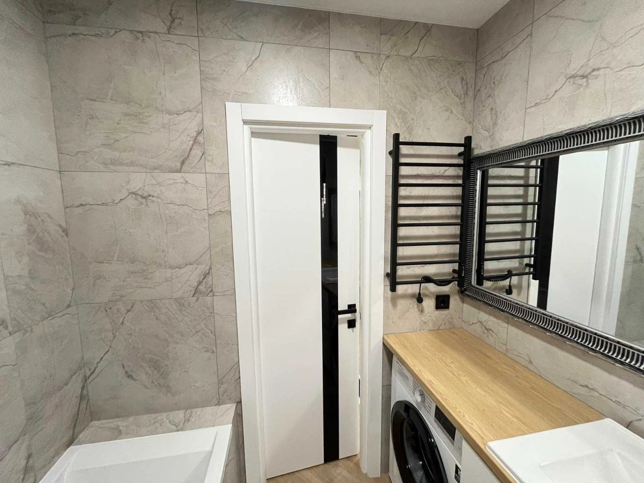 1-bedroom apartment with a view of a park area