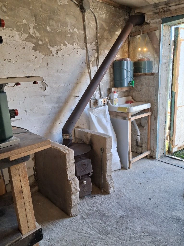 For Sale: Garage with Wood-burning Stove