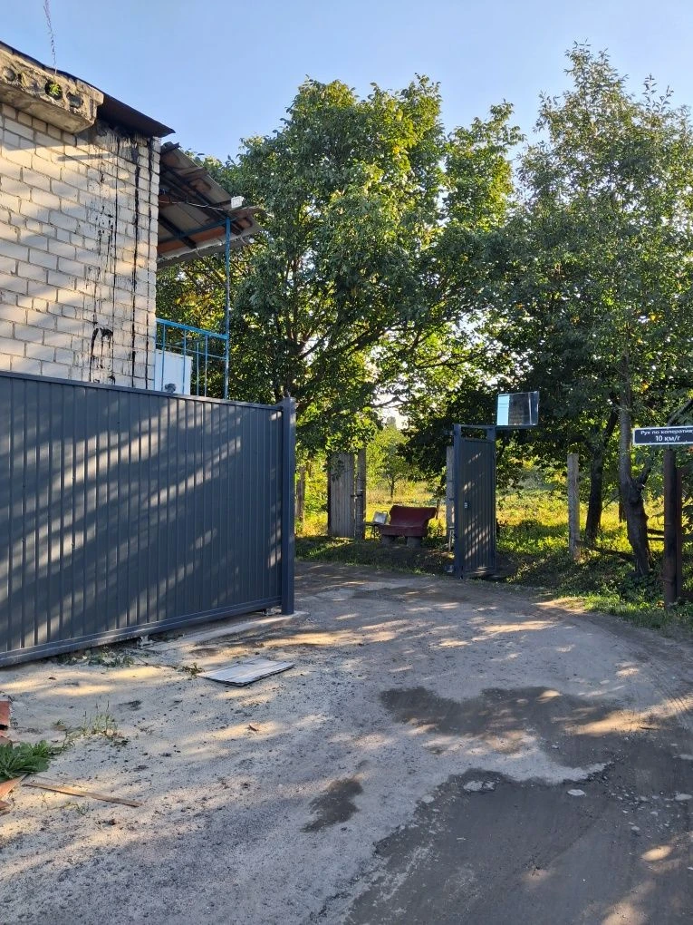 For Sale: Garage with Wood-burning Stove