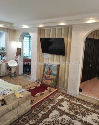 Квартира с тремя комнатами, 60 квадратных метров.