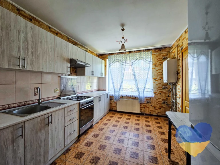 Cozy 2-bedroom apartment with its own plot in the city