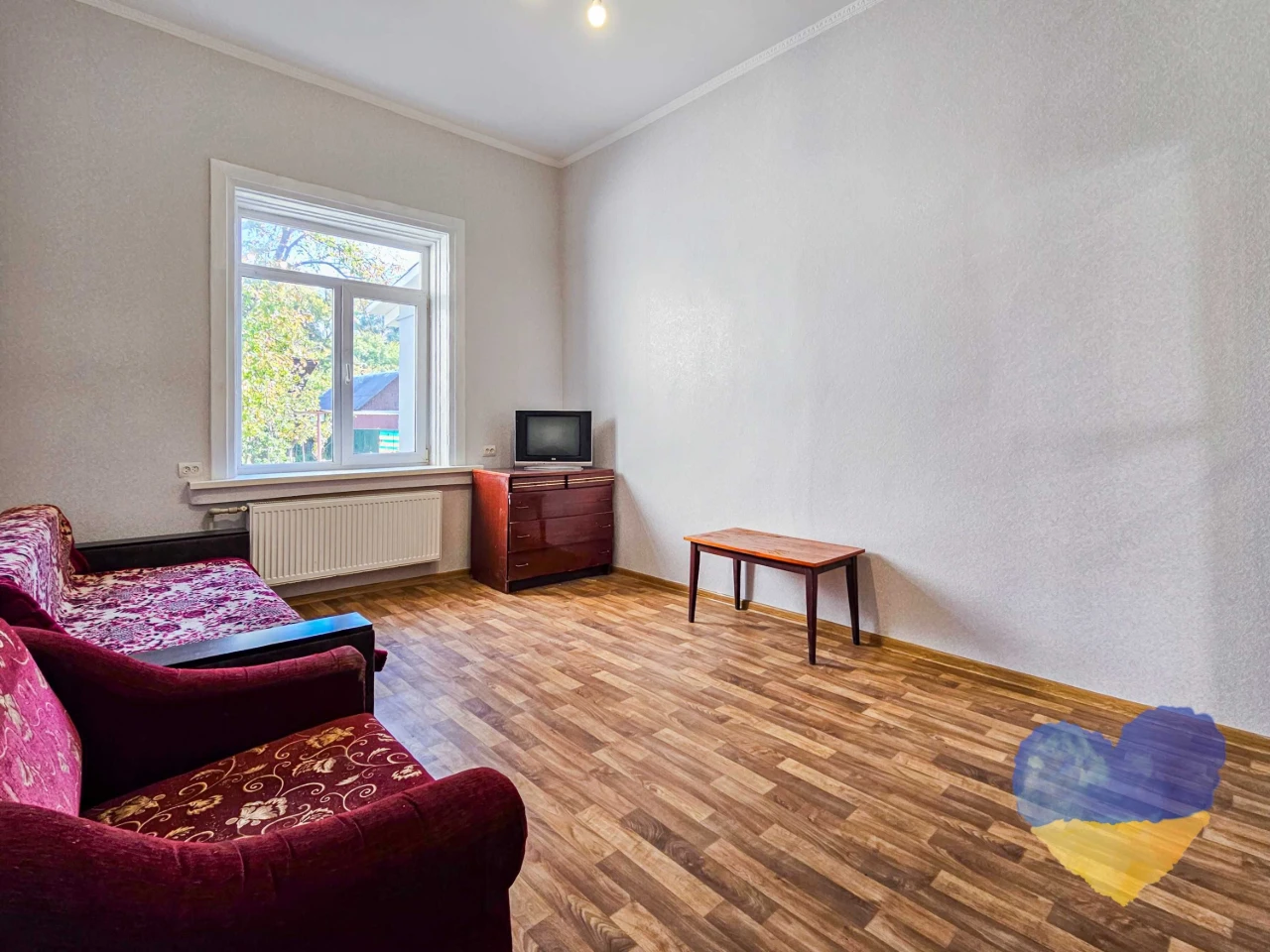 Cozy 2-bedroom apartment with its own plot in the city