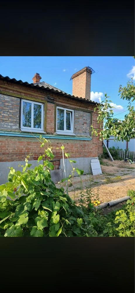 For sale: 1/2 of a house with a separate yard.