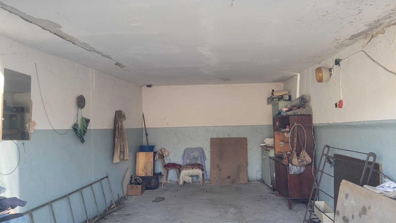 Brick garage with a pit