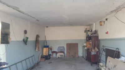 Brick garage with a pit