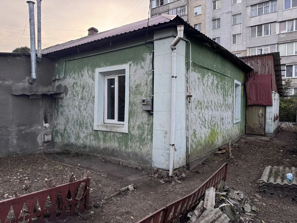 Land for sale with part of a house