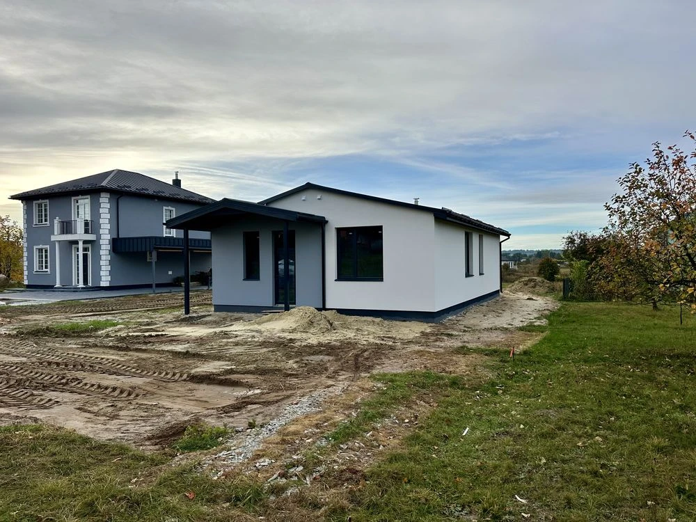 Detached brick house with convenient layout in a private plot
