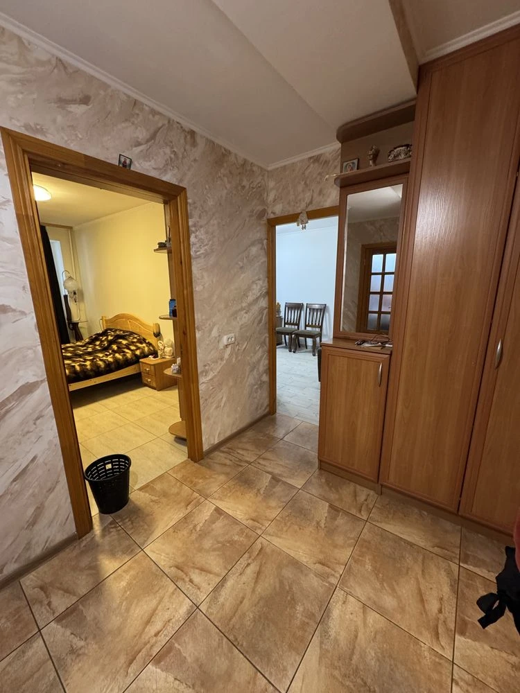 For sale is a spacious 3-bedroom apartment in the city center, on Шевchenko Street.