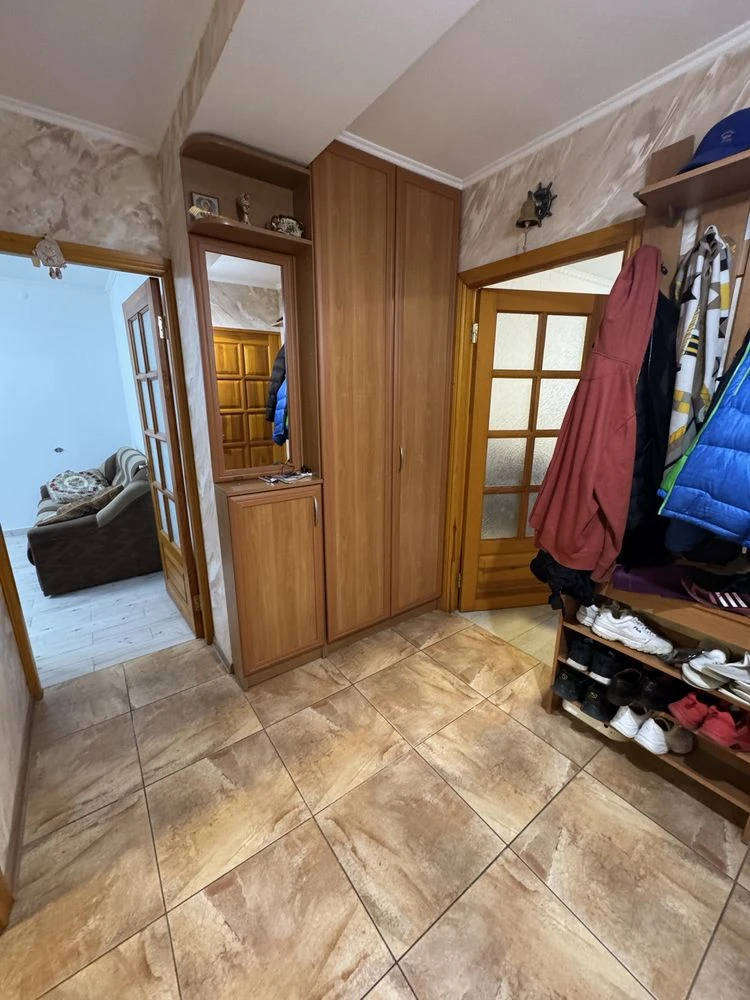 For sale is a spacious 3-bedroom apartment in the city center, on Шевchenko Street.