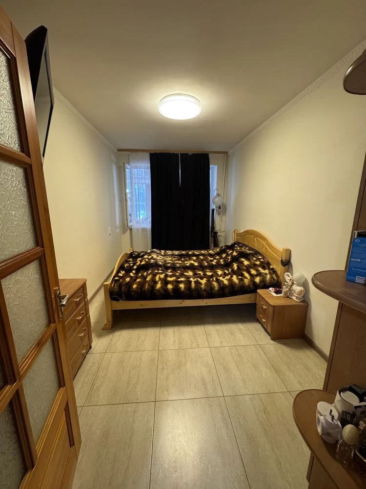For sale is a spacious 3-bedroom apartment in the city center, on Шевchenko Street.