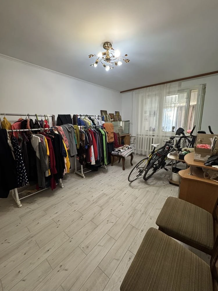 For sale is a spacious 3-bedroom apartment in the city center, on Шевchenko Street.