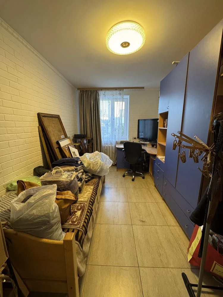 For sale is a spacious 3-bedroom apartment in the city center, on Шевchenko Street.