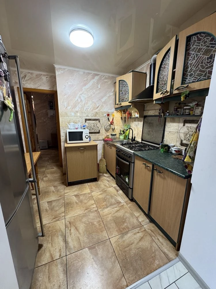 For sale is a spacious 3-bedroom apartment in the city center, on Шевchenko Street.
