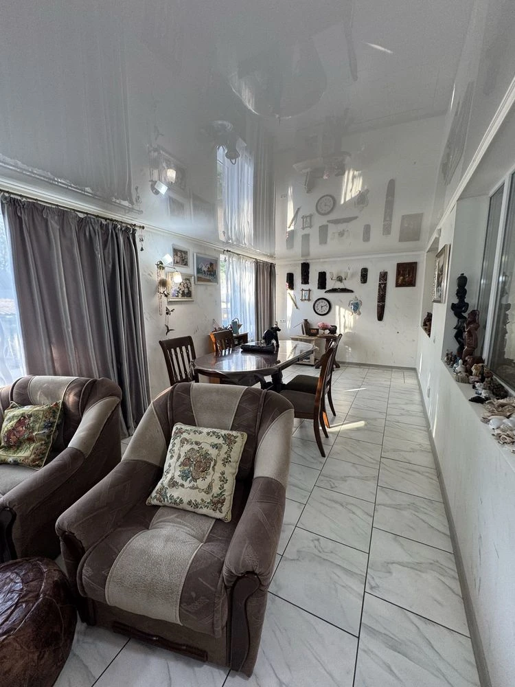 For sale is a spacious 3-bedroom apartment in the city center, on Шевchenko Street.