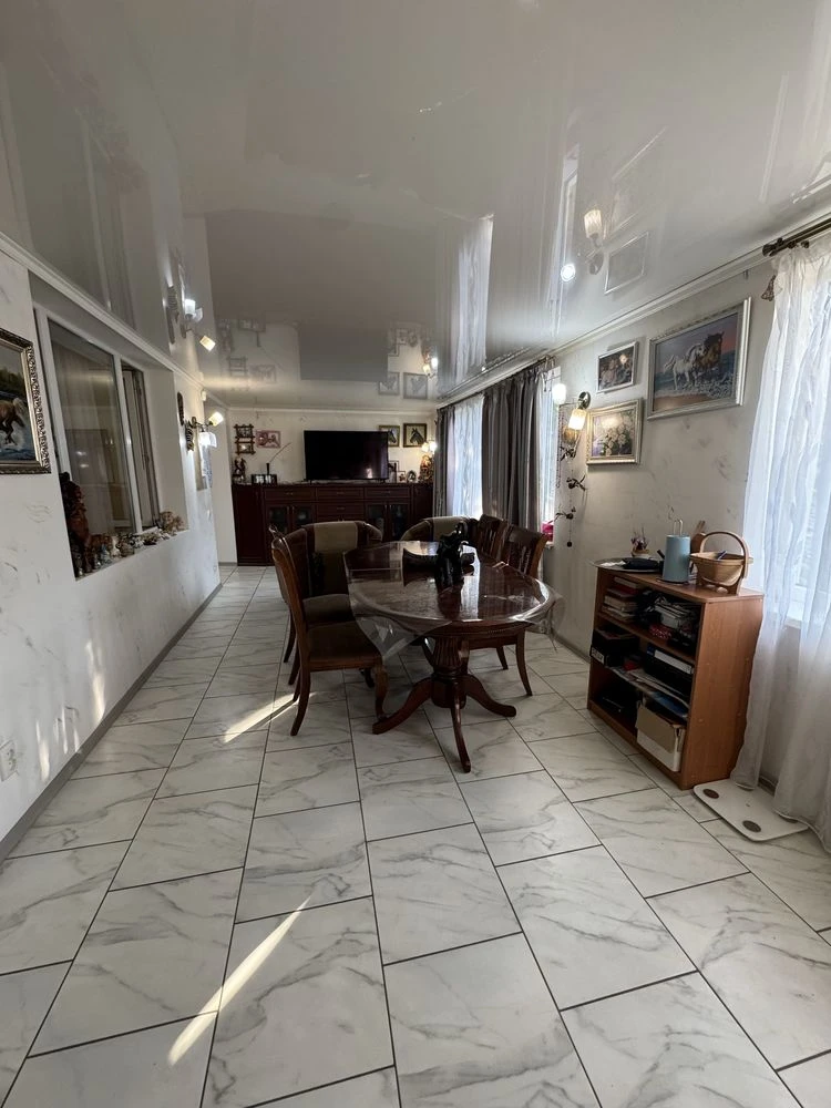 For sale is a spacious 3-bedroom apartment in the city center, on Шевchenko Street.