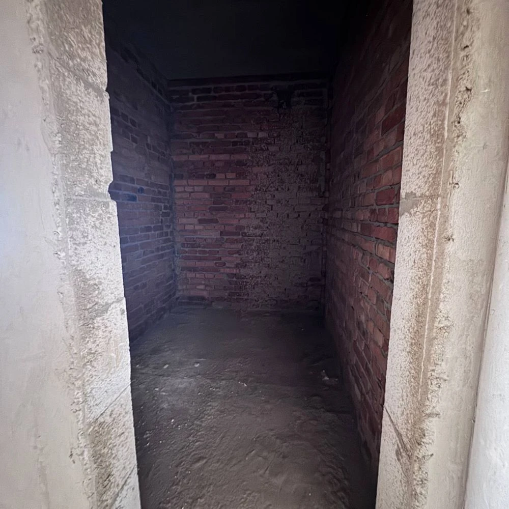 Spacious apartment with unfinished interior in a completed building,