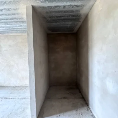 Spacious apartment with unfinished interior in a completed building,