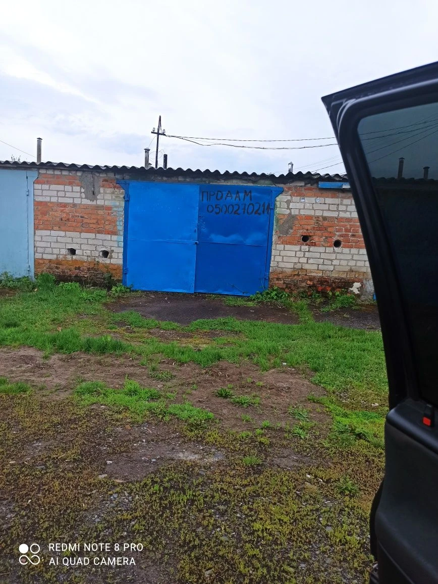 Brick garage 4/6 with pit and cellar.