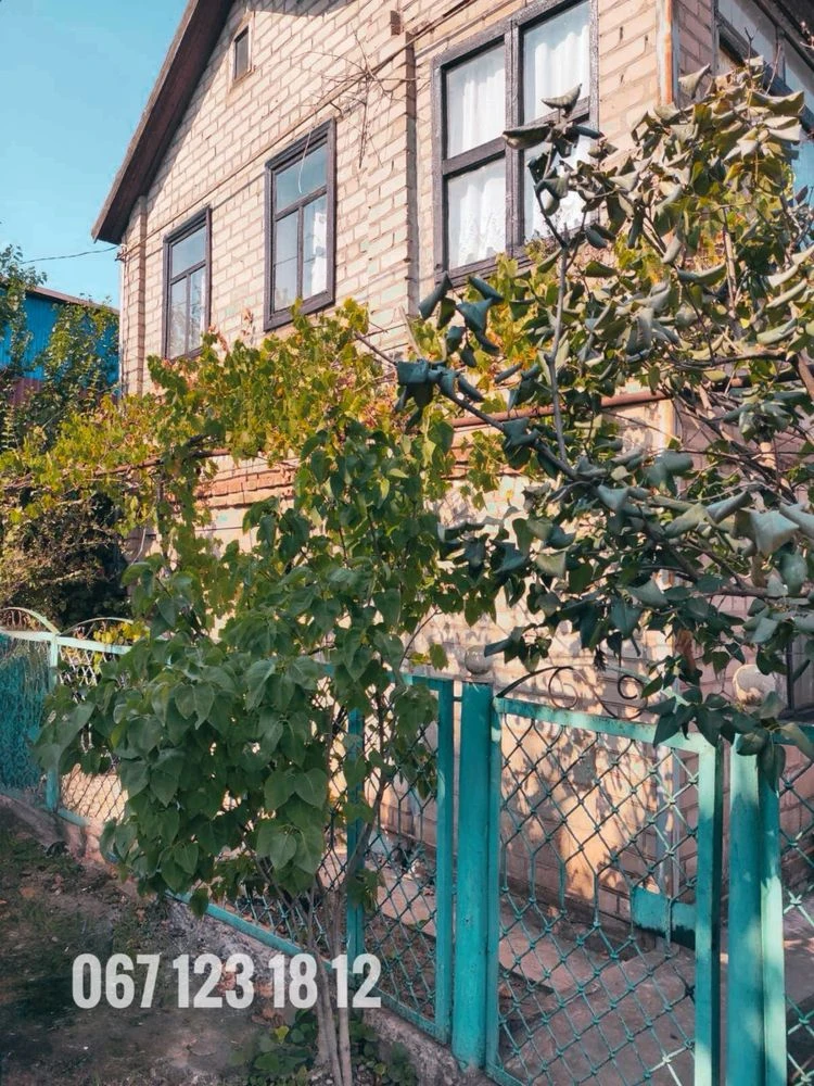 Brick 2-story cottage for sale in the city center.