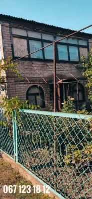 Brick 2-story cottage for sale in the city center.