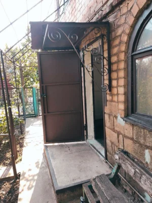 Brick 2-story cottage for sale in the city center.