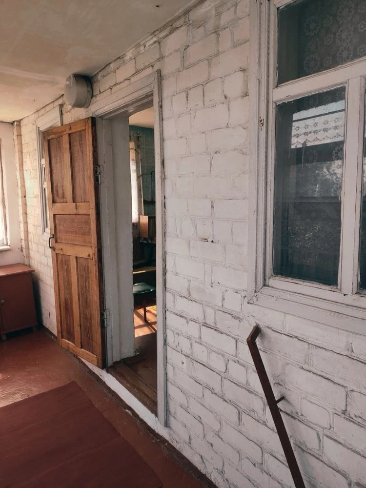 Brick 2-story cottage for sale in the city center.