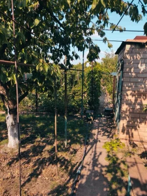 Brick 2-story cottage for sale in the city center.