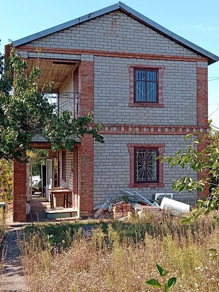 Karachuny, a two-story cottage with a stove, water, and electricity.