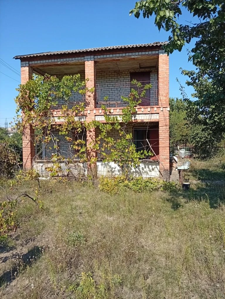 Karachuny, a two-story cottage with a stove, water, and electricity.