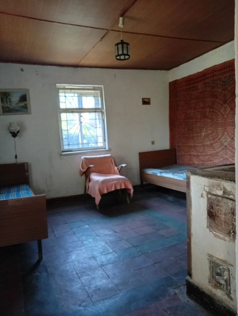 Karachuny, a two-story cottage with a stove, water, and electricity.