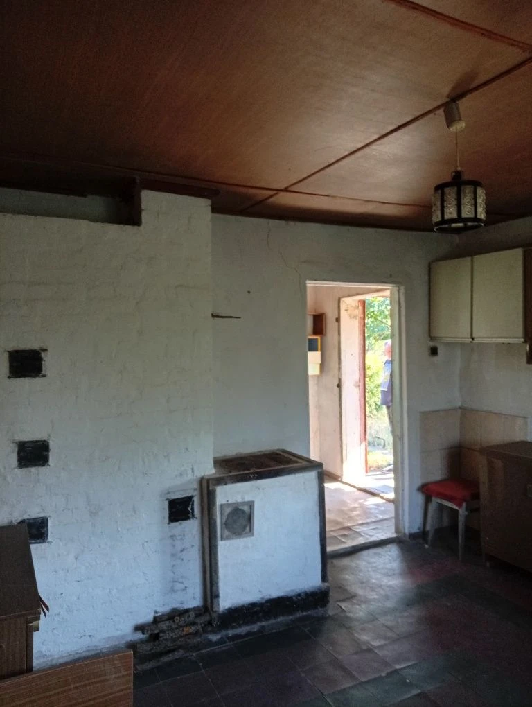 Karachuny, a two-story cottage with a stove, water, and electricity.