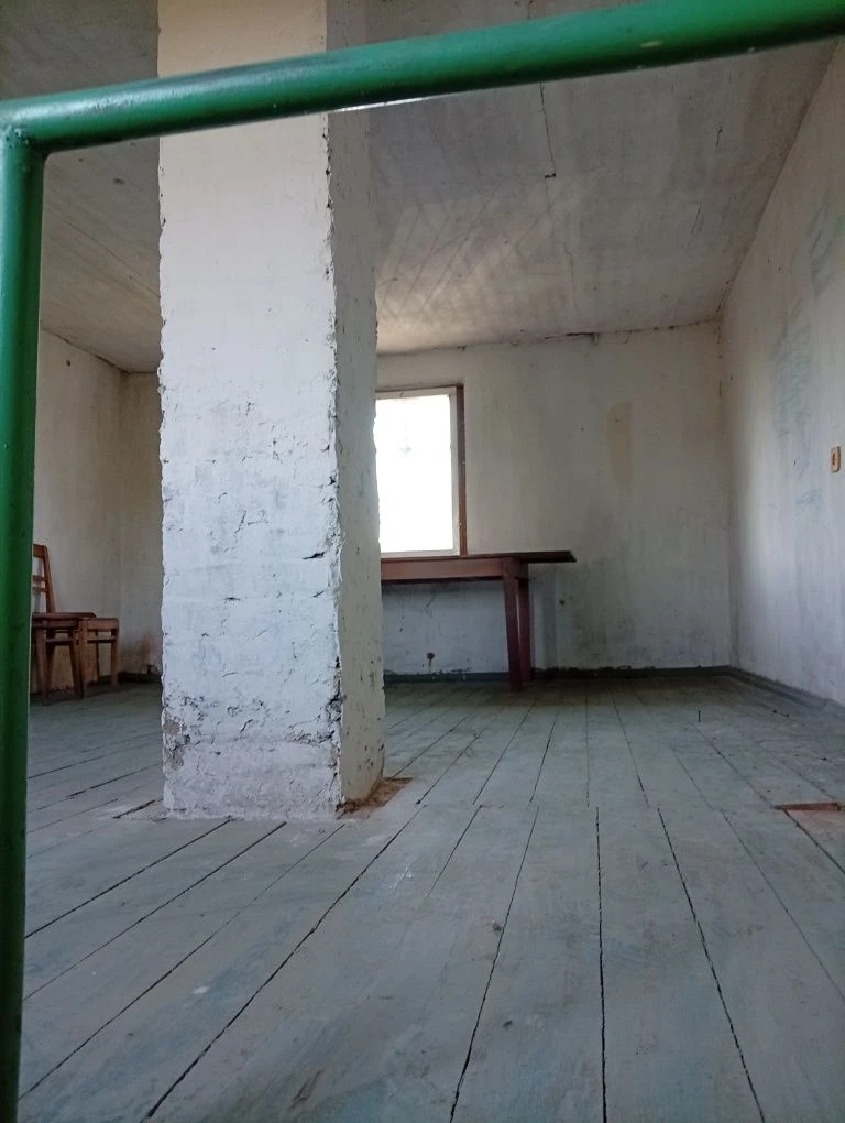 Karachuny, a two-story cottage with a stove, water, and electricity.