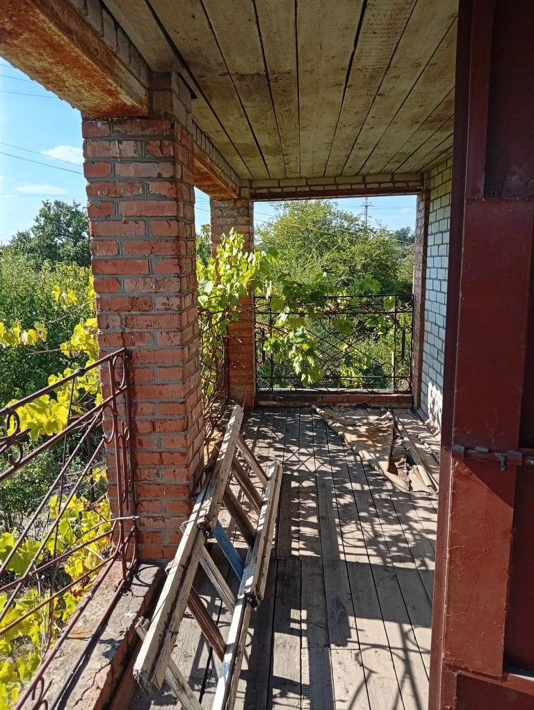 Karachuny, a two-story cottage with a stove, water, and electricity.