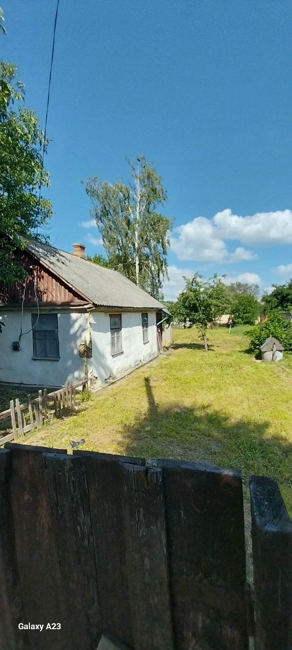 Будинок- земельна ділянка