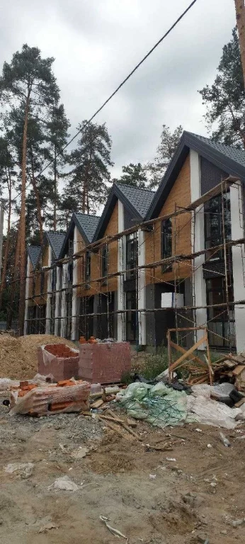 Brick Townhouses in Irpin in a Forest Green Zone
