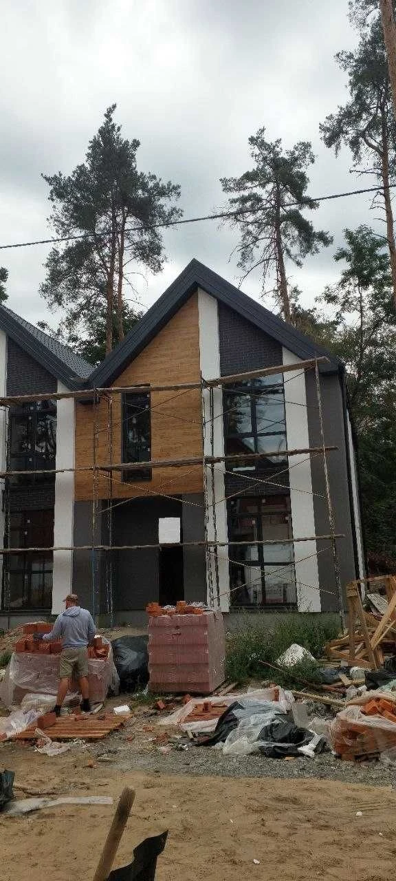 Brick Townhouses in Irpin in a Forest Green Zone