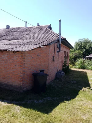 Продам 1/2 будинку із земельною ділянкою та літньою кухнею