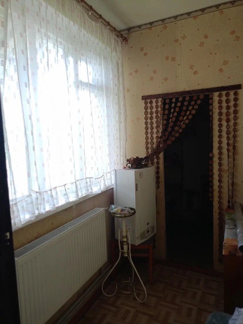 Продам 1/2 частину двоповерхового цегляного будинку.
