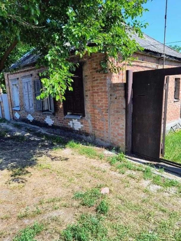Продам 1/2 дома в центре Змиева