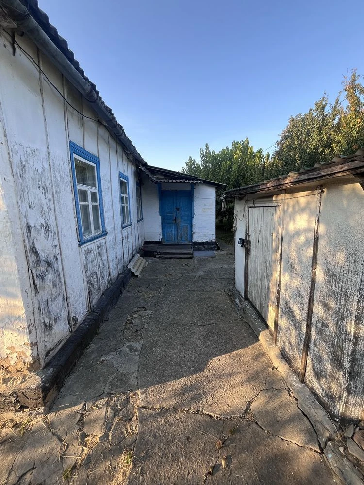 Участок з будинком