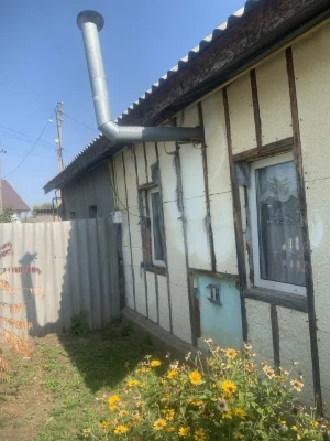 Продам 1/2 будинку поруч з центром Мерефи.